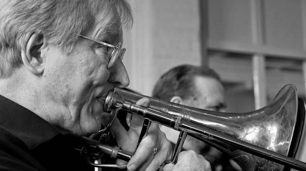 Gary Langhorst blows the trombone.